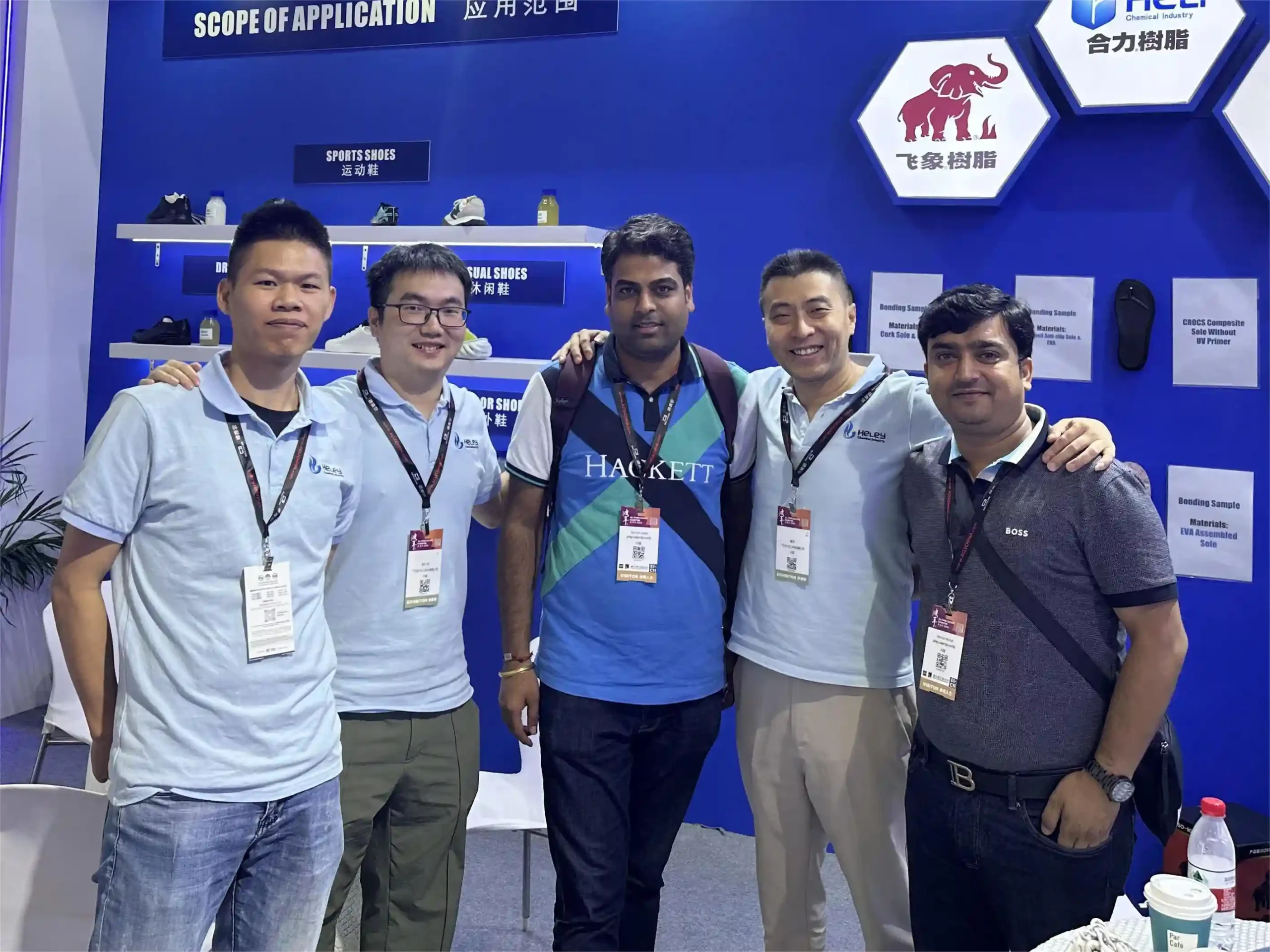 Heley team members pose at their booth during the All China Leather Exhibition Shanghai 2024