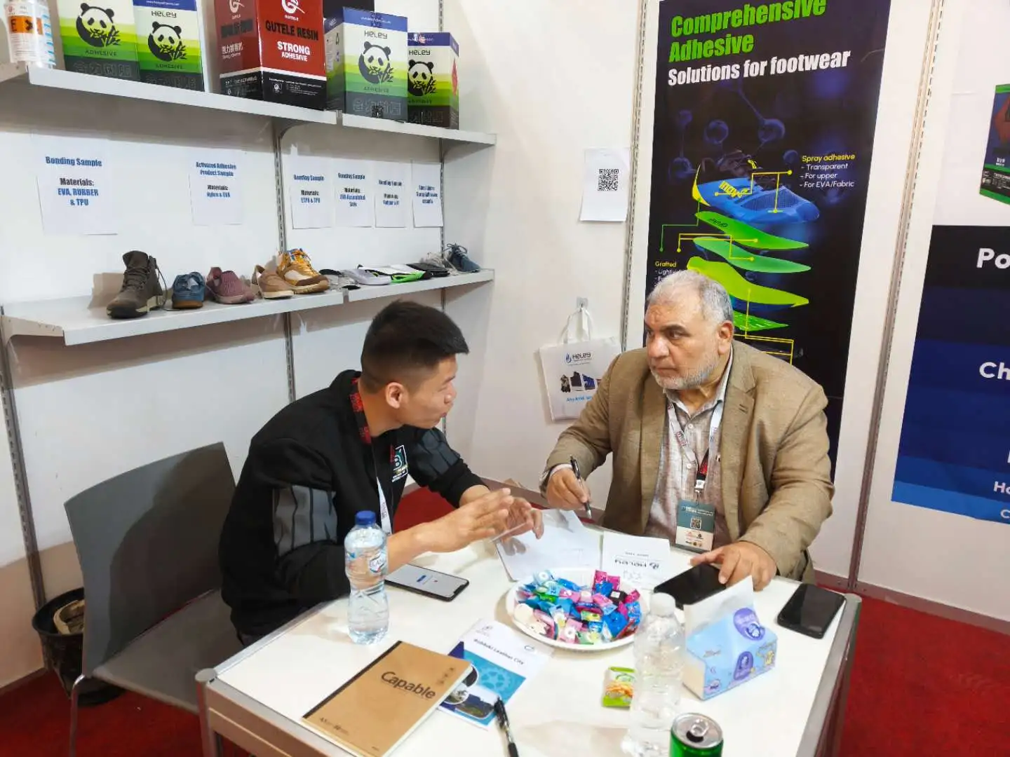 Heley talks with the customers at the Cairo inter Leather exhibition 2025