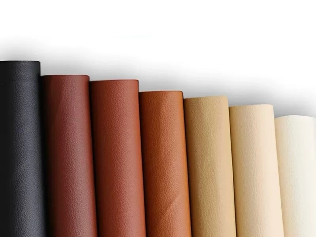 Various leather materials in different colors, showcasing options for adhesive selection based on surface texture and finish.