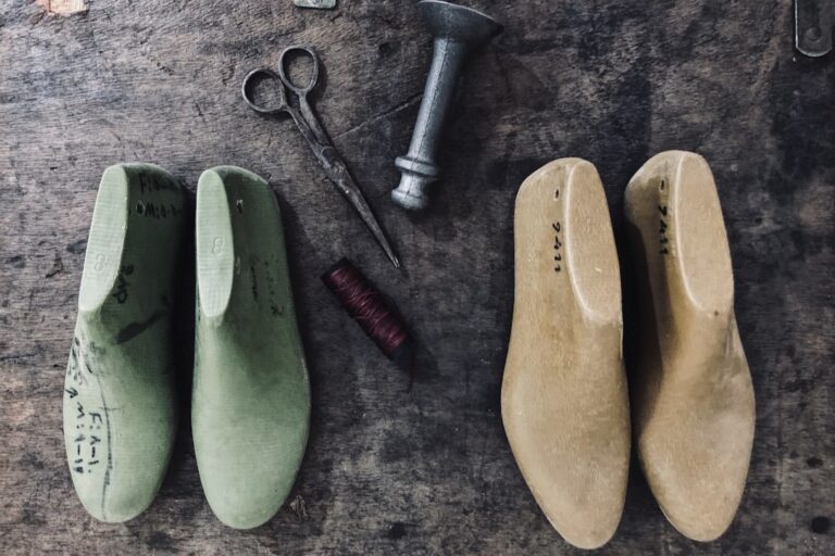 Image including the use of wooden shoe lasts and hand tools for shaping.