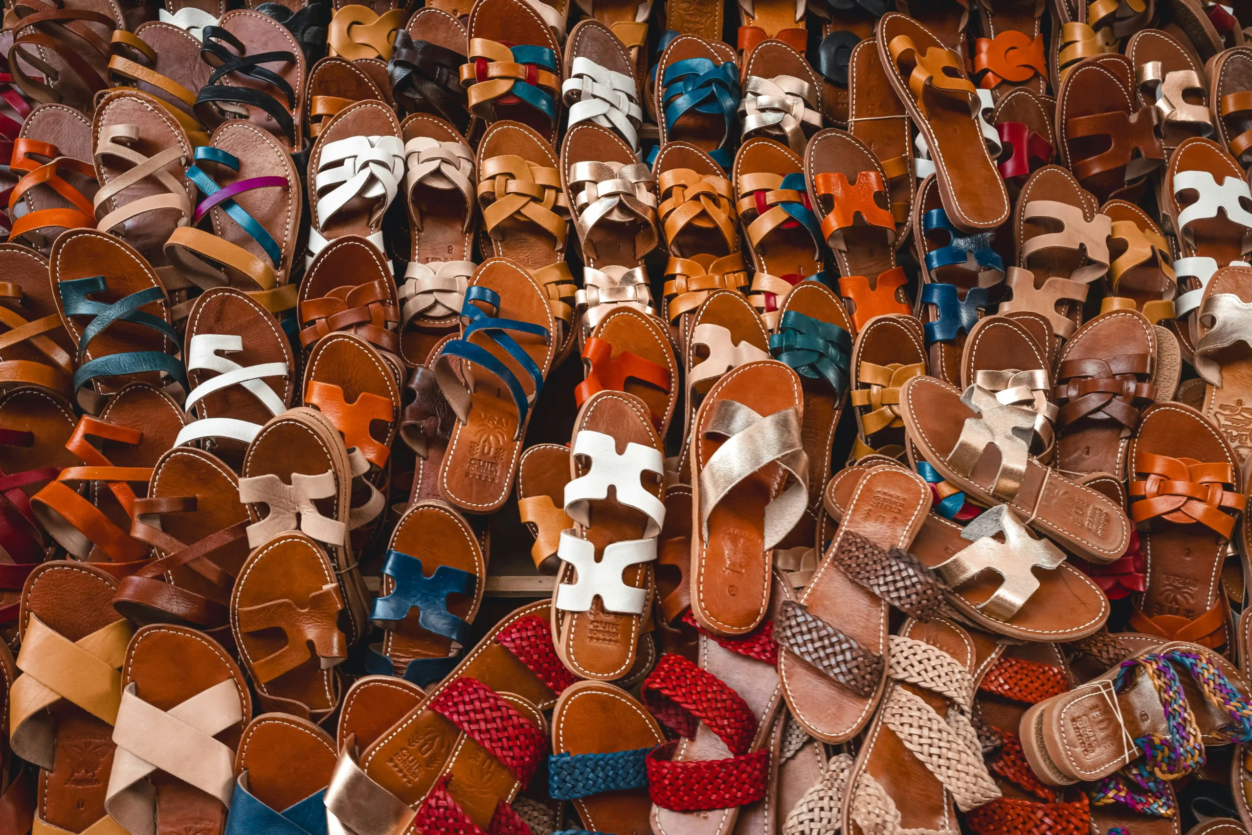 Many leather sandals of various colors
