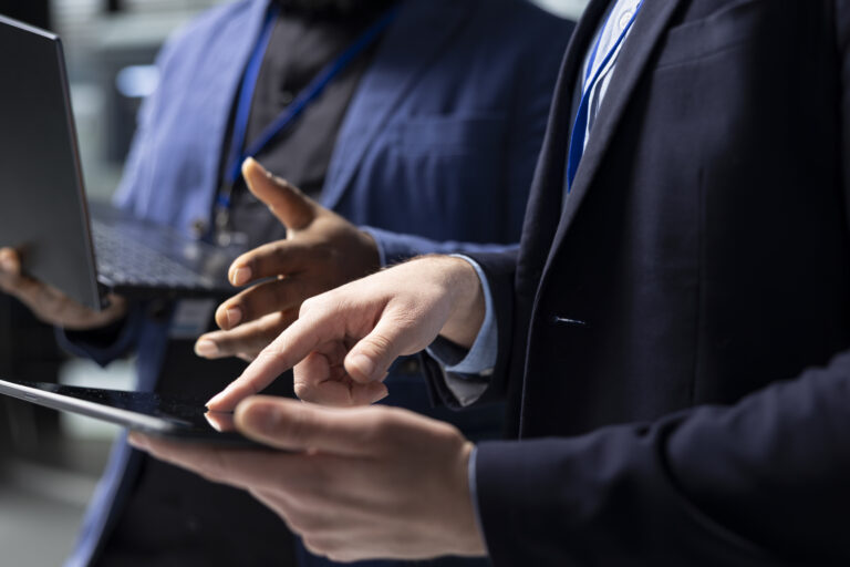 Multiethnic technicians and building contractors group analyzing data